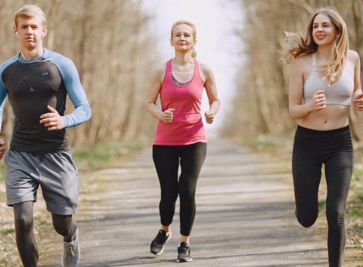 Three adults jogging on a park path, embracing a healthy and active lifestyle.